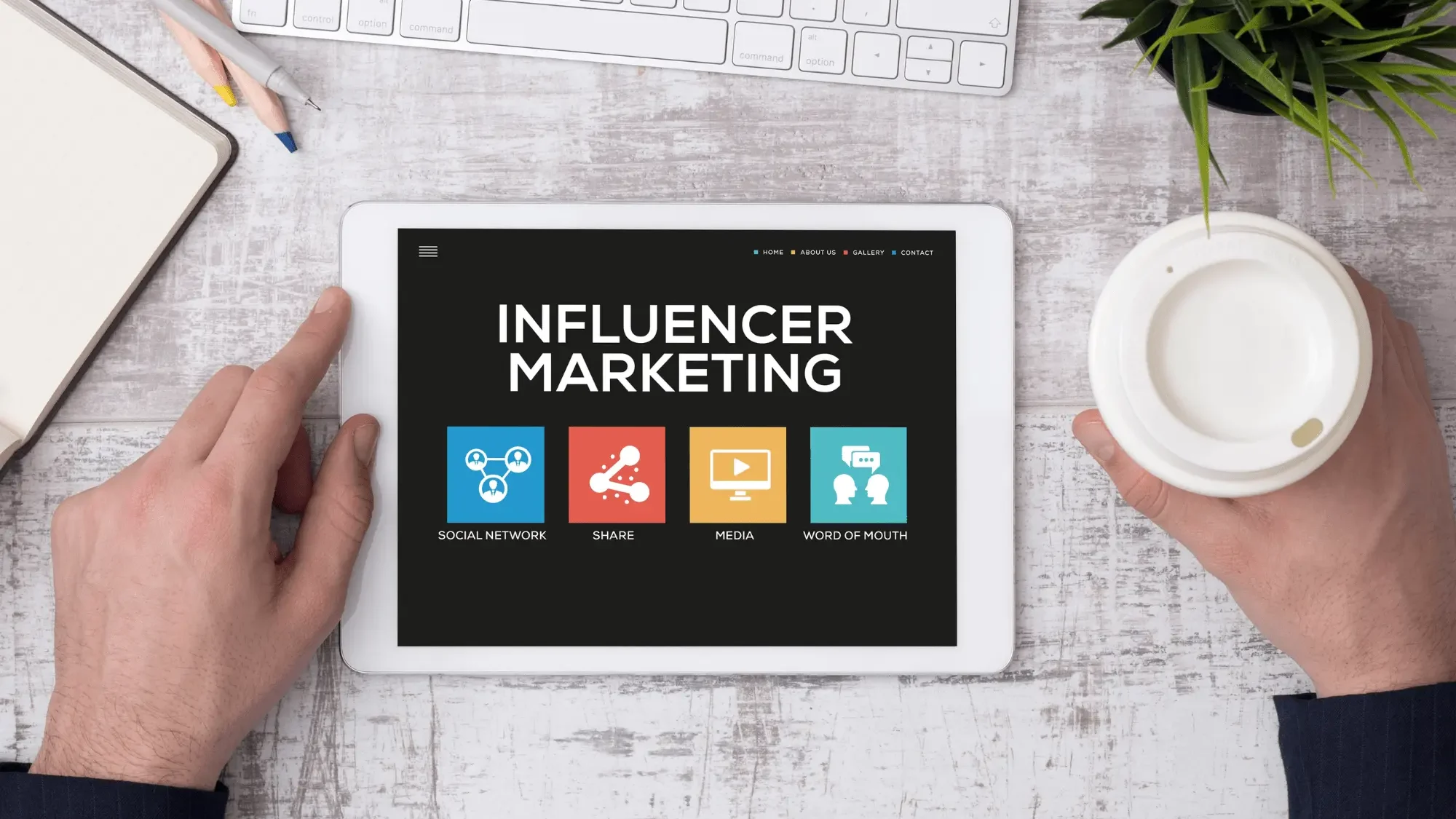Influencer Marketing written on a tablet with some social media icons